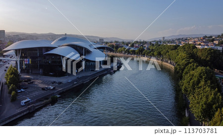 Amazing Roof of  Public Service Hall- House of Justice  and Tvtower on hill  and  car traffic on left side of Kura river 113703781