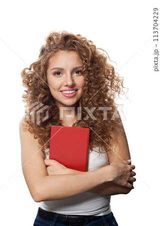 Nice happy young adult woman smiling and holding book with red empty cover isolated Nice happy young adult woman smiling and holding book with red empty cover isolated 113704229
