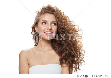 Portrait of young woman with natural make-up, clear fresh skin and wavy hairstyle Portrait of young woman with natural make-up, clear fresh skin and wavy hairstyle 113704230