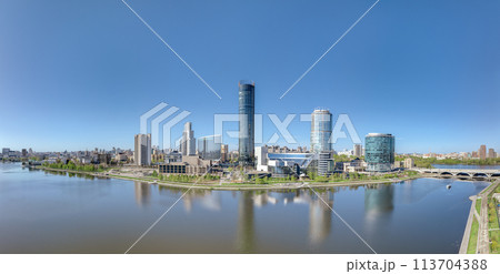 Yekaterinburg city with Buildings of Regional Government and Parliament, Dramatic Theatre, Iset Tower, Yeltsin Center, panoramic view at summer sunset. 113704388