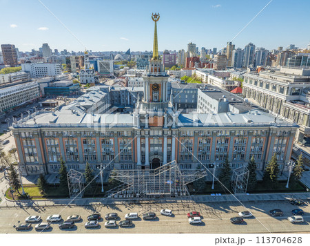 Yekaterinburg City Administration or City Hall and Central square at summer evening. Evening city in the summer sunset, Aerial View. Yekaterinburg City Administration or City Hall and Central square at summer evening. Evening city in the summer sunset, Aerial View. 113704628