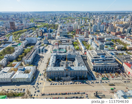 Yekaterinburg City Administration or City Hall and Central square at summer evening. Evening city in the summer sunset, Aerial View. Yekaterinburg City Administration or City Hall and Central square at summer evening. Evening city in the summer sunset, Aerial View. 113704630