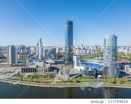 Yekaterinburg city with Buildings of Regional Government and Parliament, Dramatic Theatre, Iset Tower, Yeltsin Center, panoramic view at summer sunset. Yekaterinburg city with Buildings of Regional Government and Parliament, Dramatic Theatre, Iset Tower, Yeltsin Center, panoramic view at summer sunset. 113704638