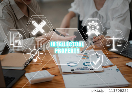 Intellectual property concept, Business team analyzing income charts and graphs on office desk with design, patents, invention, copyright, law and protection icon on virtual screen. 113706223