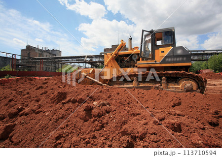 Heavy Power Bulldozer work on a building site Heavy Power Bulldozer work on a building site 113710594