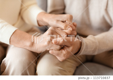 Close-up of tender hands holding tightly Close-up of tender hands holding tightly 113710837
