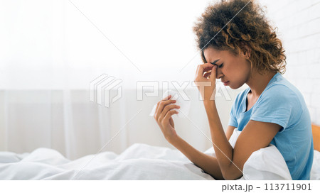 Young sick woman with flu blowing her nose Young sick woman with flu blowing her nose 113711901
