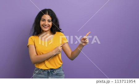 Woman in yellow pointing in two directions Woman in yellow pointing in two directions 113711954