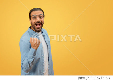 Man looking surprised and pointing to himself Man looking surprised and pointing to himself 113714205