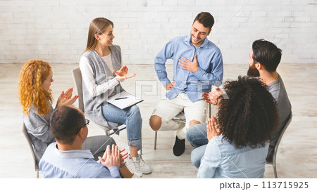 Happy people clapping at support group meeting Happy people clapping at support group meeting 113715925