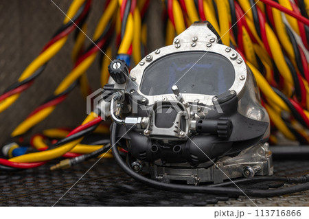 Photo of a commercial dive helmet on the ground 113716866