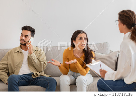 Couple in therapy session with counselor, crisis in relationships Couple in therapy session with counselor, crisis in relationships 113717139