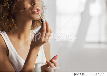 Girl doing make-up 113717153