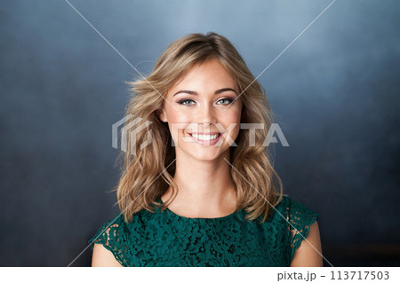 Nice young friendly woman smiling on blue background Nice young friendly woman smiling on blue background 113717503