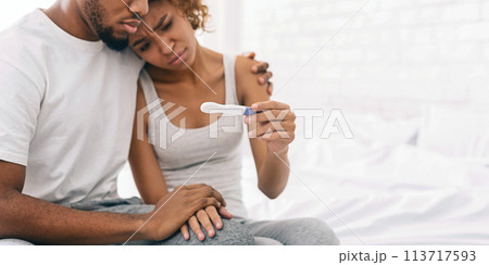 Black couple with a negative pregnancy test result 113717593