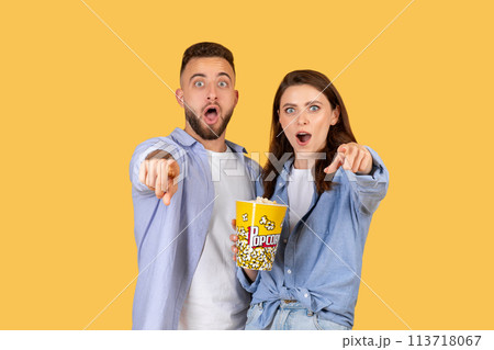 Two people shocked watching with popcorn 113718067