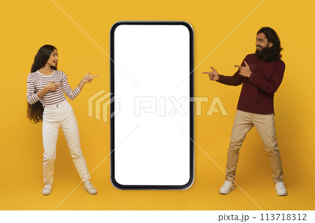 Two people pointing at smartphone screen mockup 113718312