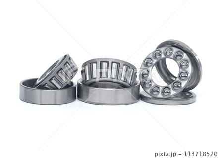 Tapered roller and thrust ball bearings isolated on white 113718520
