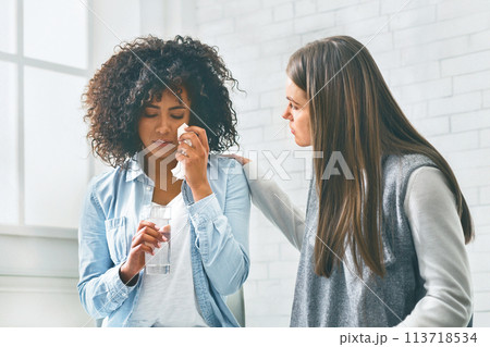 Diverse People Showing Empathy To Crying Black Woman 113718534