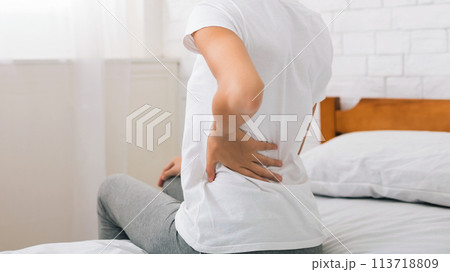 African-american woman having back pain after sleep 113718809