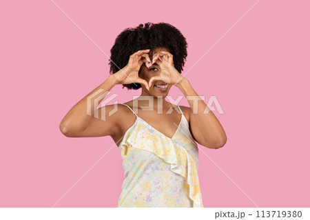 Woman with covered face posing on pink background Woman with covered face posing on pink background 113719380