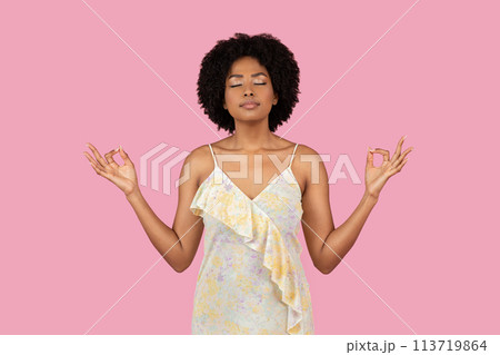 African American woman meditating with eyes closed 113719864