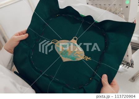 Embroidery machine needle in Textile Industry at Garment Manufacturers, Embroidery T-shirt in progress, Needle with thread 113720904