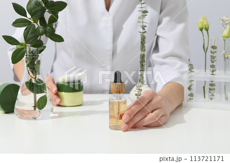 Cosmetics with chemical flasks and a flower Cosmetics with chemical flasks and a flower 113721171