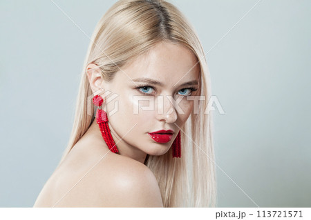 Stylish female face. Young blonde woman on white background Stylish female face. Young blonde woman on white background 113721571