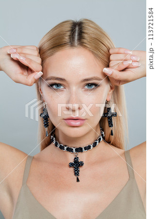 Close up face of fashion jewelry model woman. Lady with fresh clean skin, blonde hair 113721584