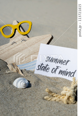 SUMMER STATE OF MIND text on paper greeting card on background of funny starfish in glasses summer vacation decor. Sandy beach sun coast. Holiday concept postcard. Getting away Travel 113721815