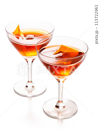 Refreshing Bourbon Manhattan cocktail with vermouth and maraschino cherry garnish isolated on white background. Refreshing Bourbon Manhattan cocktail with vermouth and maraschino cherry garnish isolated on white background. 113722961