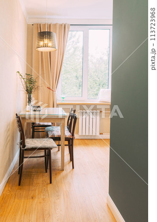 Modern Bright Kitchen In Scandinavian Stylish. Family Apartment With Dinner Table And Chairs. Idea For Home Design. Light Colors Of Design. Stylish Apartment Interior Of Kitchen 113723968