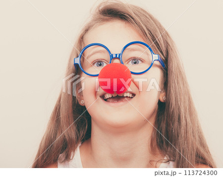 Little girl with red nose 113724300
