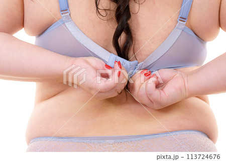 Woman wearing bra. Back view Woman wearing bra. Back view 113724676