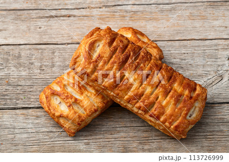 Golden Puff pastry stuffed with sausage and cheese 113726999