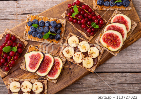 Rice cake with banana  blueberry redcurrant and figs 113727022