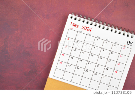 May 2024 desk calendar on red background. May 2024 desk calendar on red background. 113728109