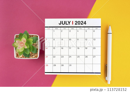 White calendar for July 2024 and pen on beautiful background. White calendar for July 2024 and pen on beautiful background. 113728152