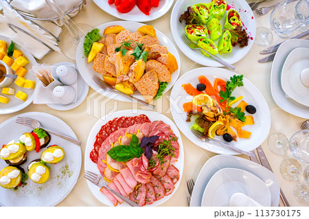 meal at the banquet. good cuts of meat, cheese. the holiday table 113730175