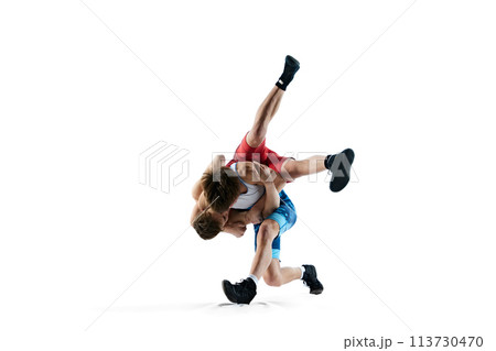 Male wrestlers compete in intense poses, displaying athletic skills, training isolated on white background Male wrestlers compete in intense poses, displaying athletic skills, training isolated on white background 113730470