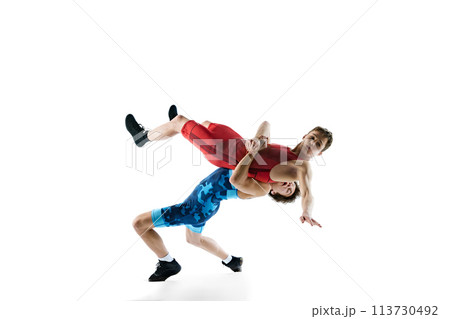 Young boys, athletes wrestling, training, displaying skill and strategy for victory, isolated on white background 113730492