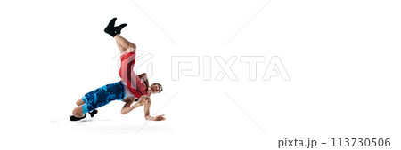 Young men, wrestling athletes competing, demonstrating strength and agility, training isolated on white background. Banner 113730506