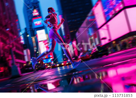Young athletic woman in sportswear and headphones running along empty street illuminated by neon lights. Essence of healthy and active lifestyle. Young athletic woman in sportswear and headphones running along empty street illuminated by neon lights. Essence of healthy and active lifestyle. 113731853
