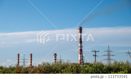 The white and red chimneys of the factory 113733591