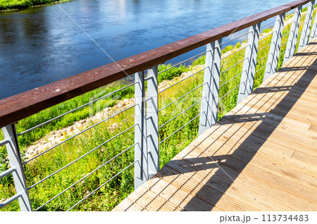 Metal fence on the city embankment Metal fence on the city embankment 113734483