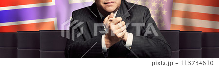 Politician or businessman on oil barrels background and background of Norway and USA flags Politician or businessman on oil barrels background and background of Norway and USA flags 113734610