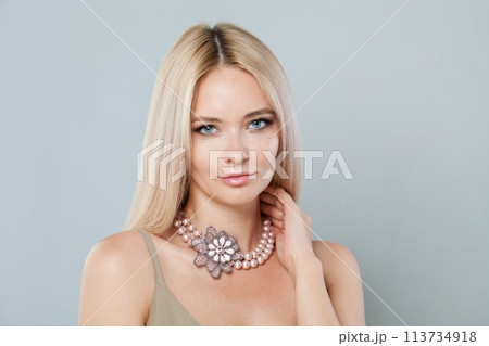 Smiling fashion model woman with clear fresh perfect skin and long blonde hair Smiling fashion model woman with clear fresh perfect skin and long blonde hair 113734918