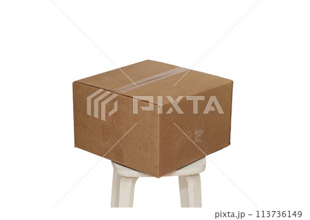 Rectangle cardboard box on beige stool for creative arts and toy storage Rectangle cardboard box on beige stool for creative arts and toy storage 113736149