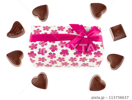 Chocolate candy and a box of chocolates in gift wrapping isolated on white. There is free space for text. Collage. 113736637